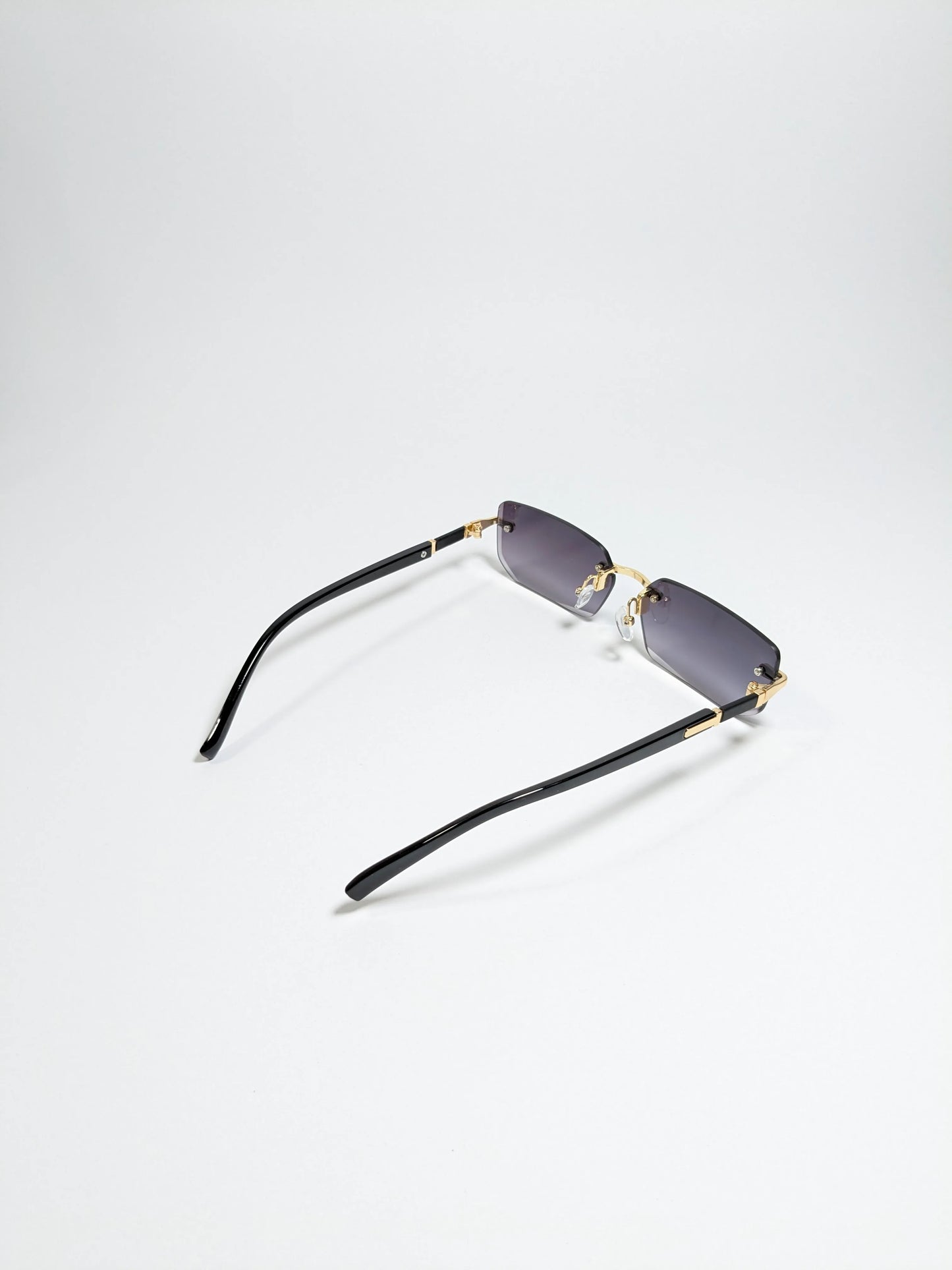 Car tierr - md005 (1) Rimless, Golden and Black Arms with rectangle diamond cut lens sunglasses (Box Included)