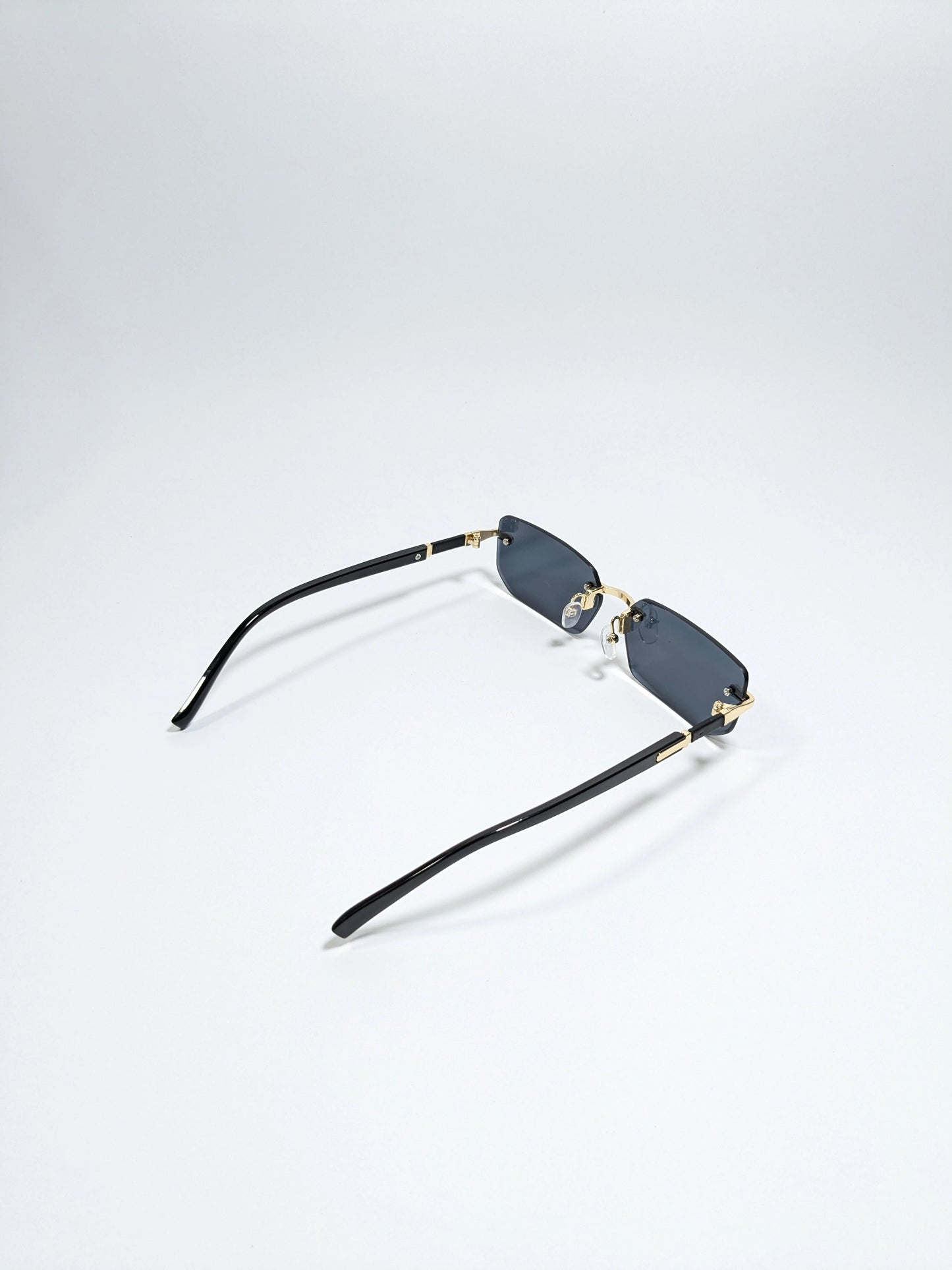 Car tierr - md005 (1) Rimless, Golden and Black Arms with rectangle diamond cut lens sunglasses (Box Included)